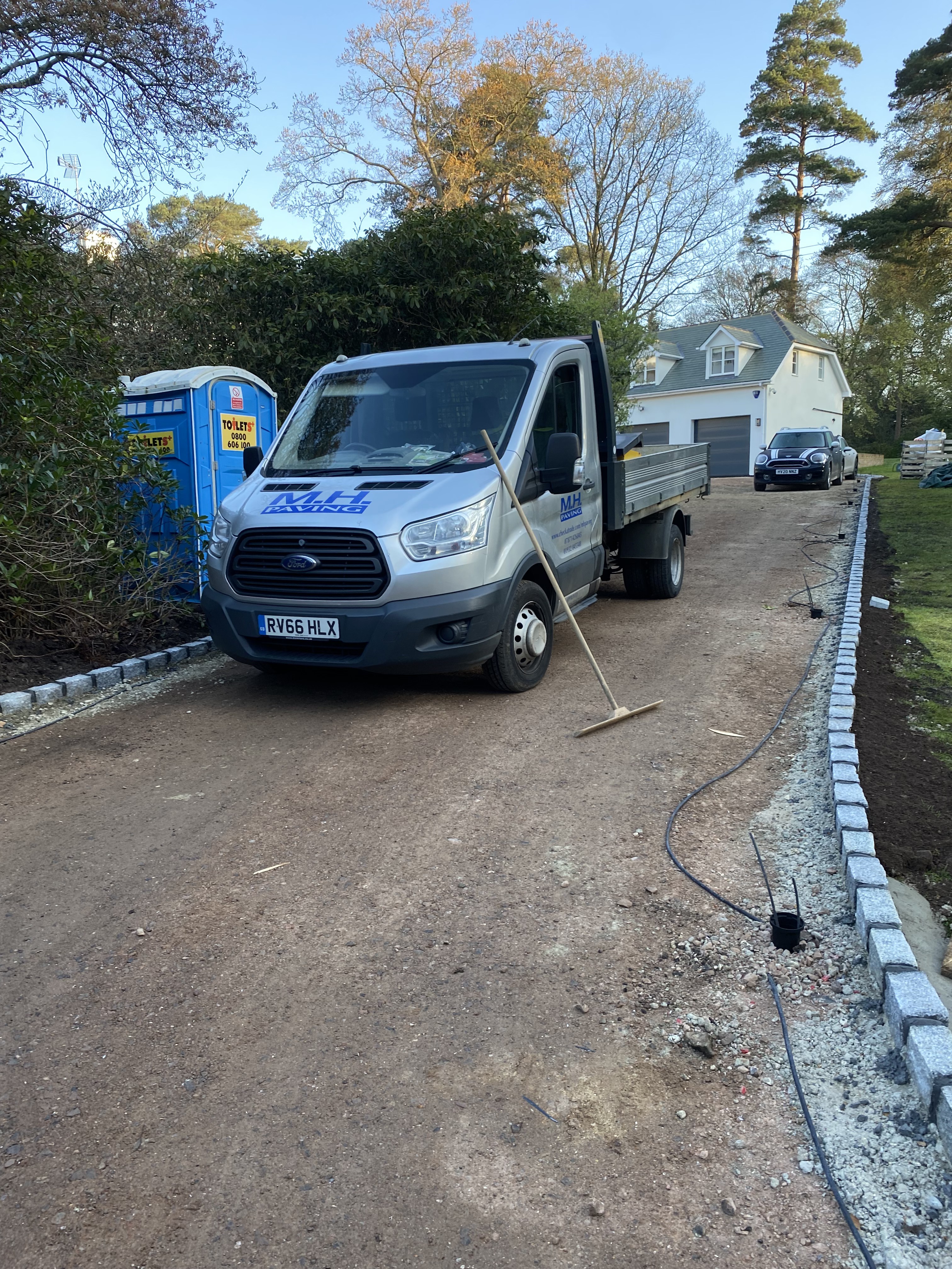 Completed resin-bound driveway with landscaped garden in Surrey